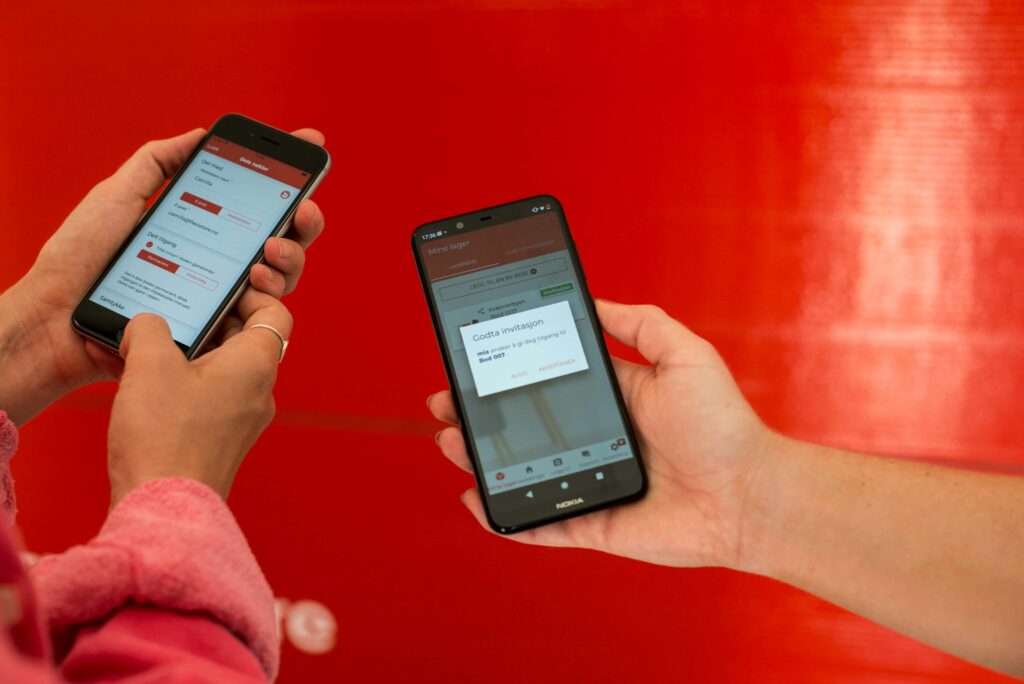 Two phones sharing access to a flexistore unit through the app.